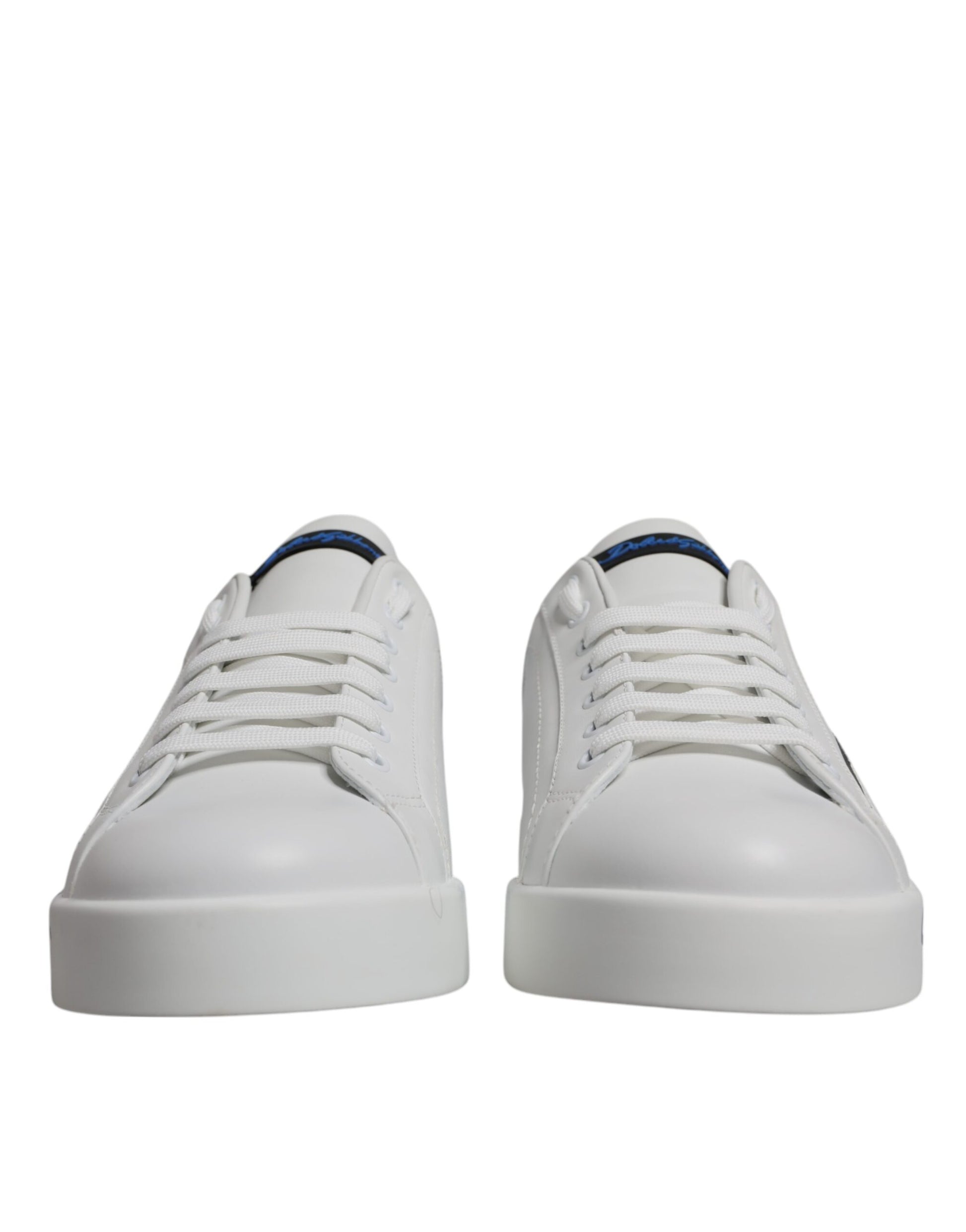 Pair of white sneakers with blue logo and laces, featuring low top design