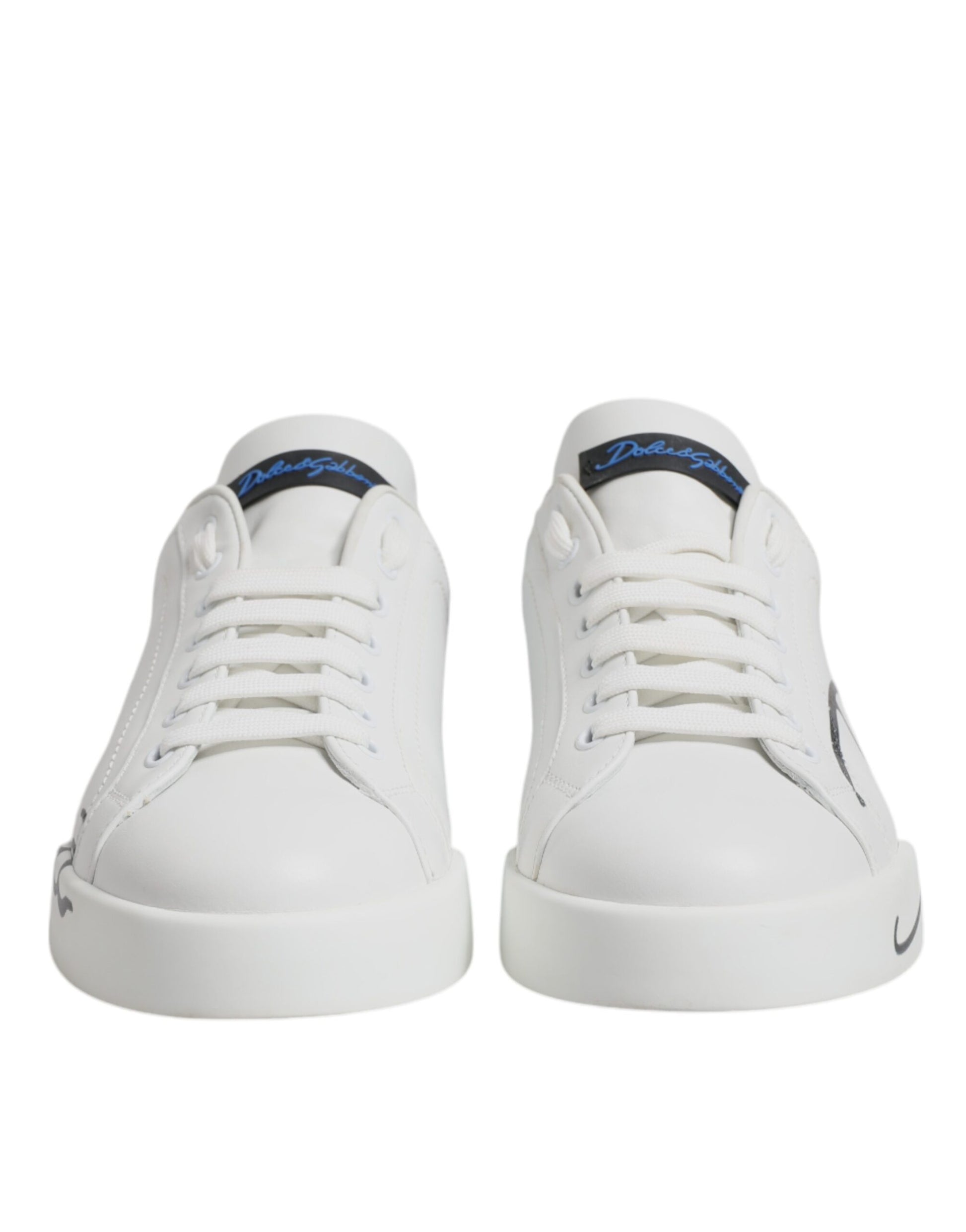 Pair of white sneakers with blue logo and laces, featuring a low top design
