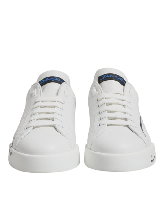 Pair of white sneakers with blue logo and laces, featuring a low top design