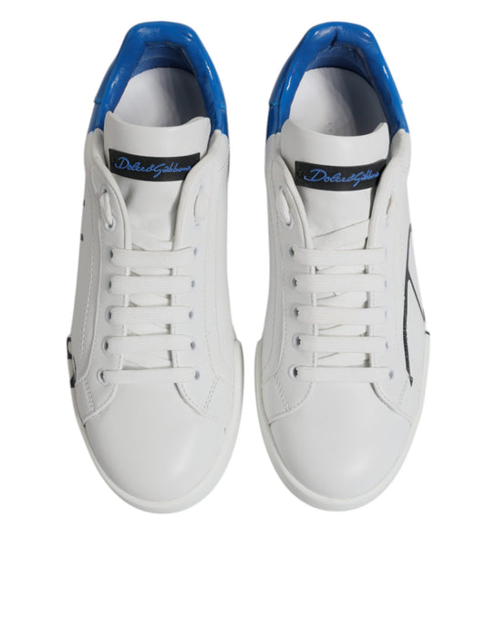 Pair of white and blue leather sneakers with logo on side, laces, and rubber sole