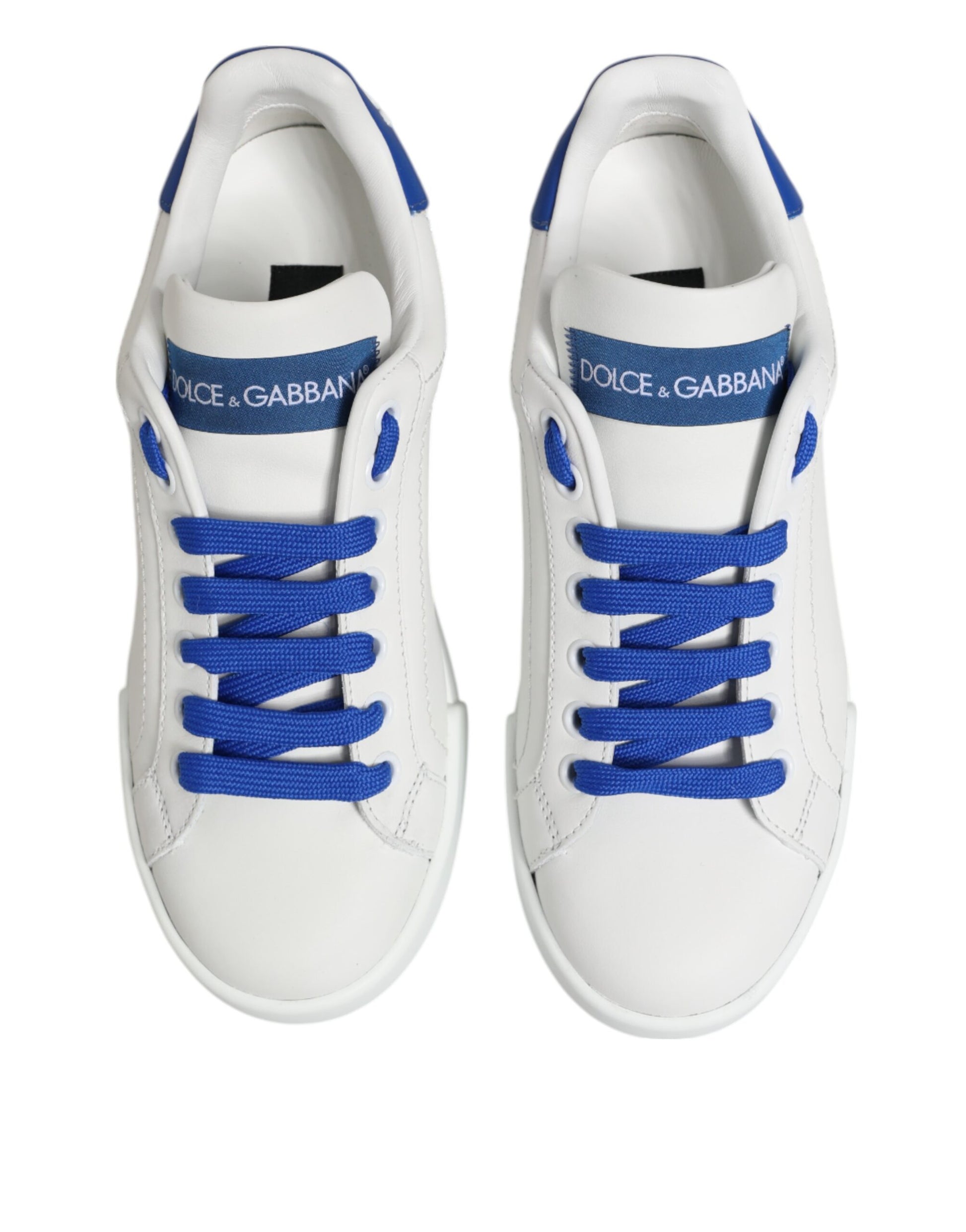 Pair of white sneakers with blue laces