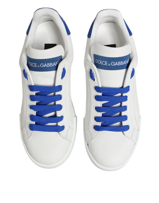 Pair of white sneakers with blue laces