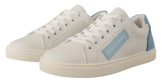Pair of white sneakers with blue accents and a logo on the side