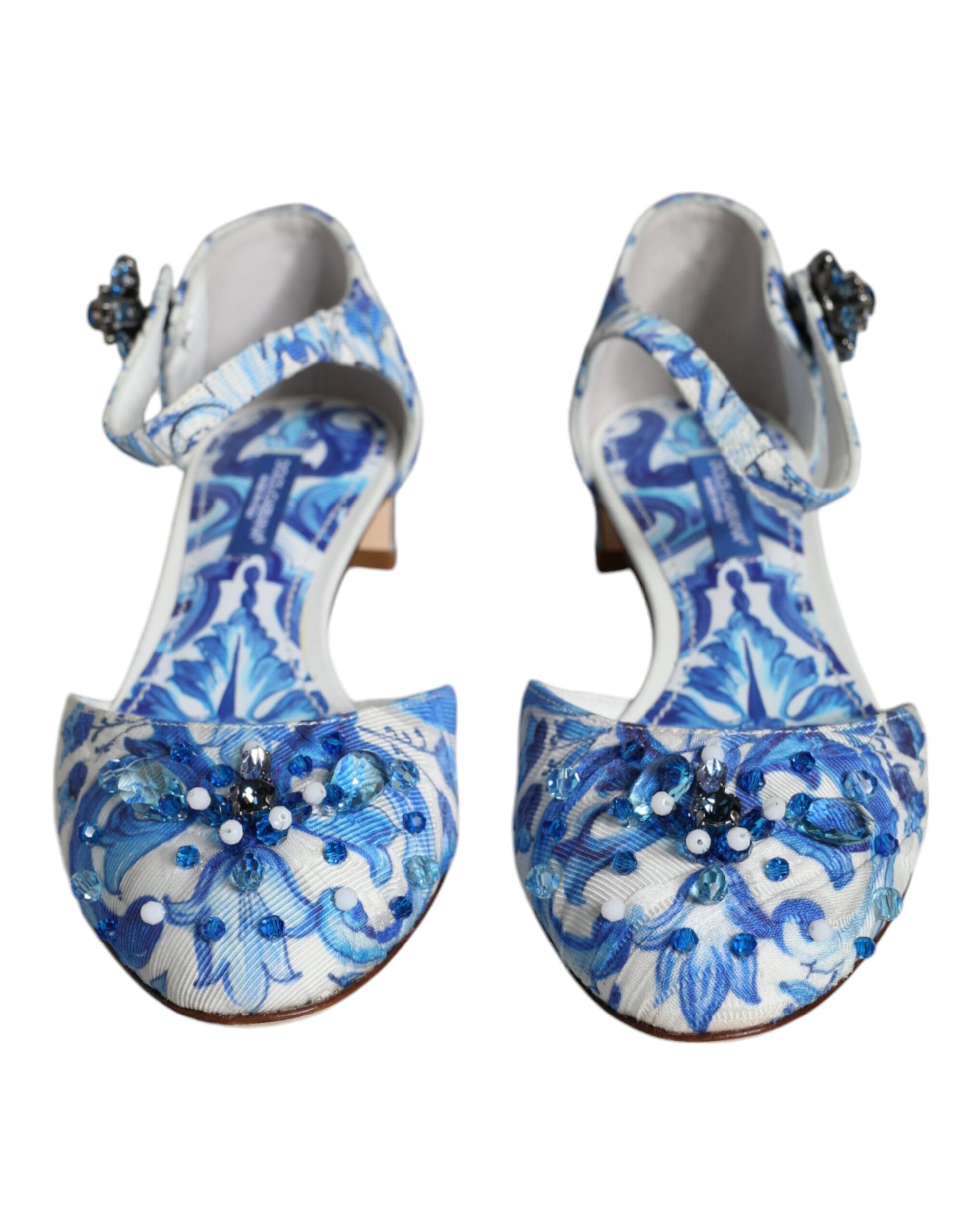 Pair of blue floral patterned high heel shoes with embellishments