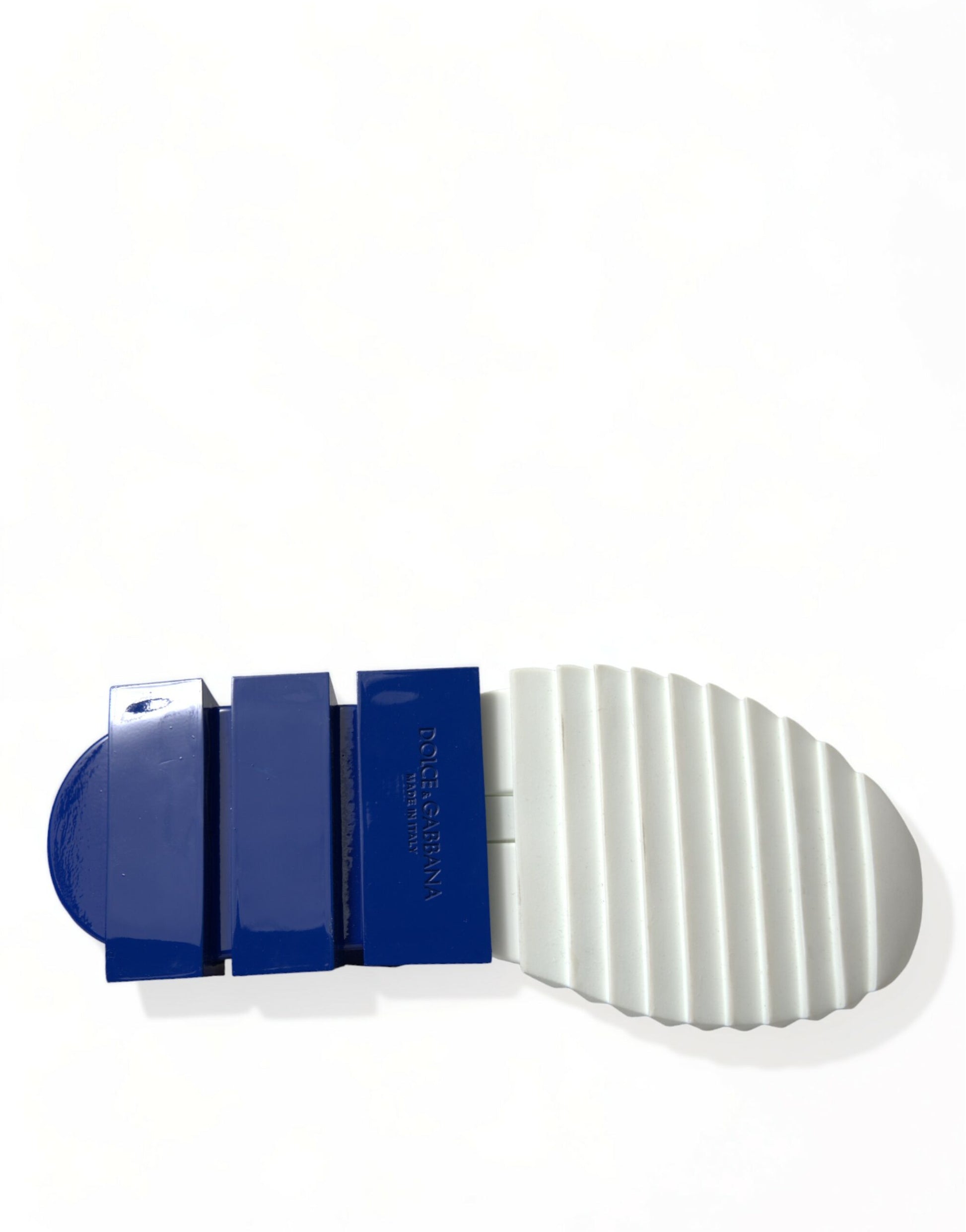 Blue and white plastic parts on a surface
