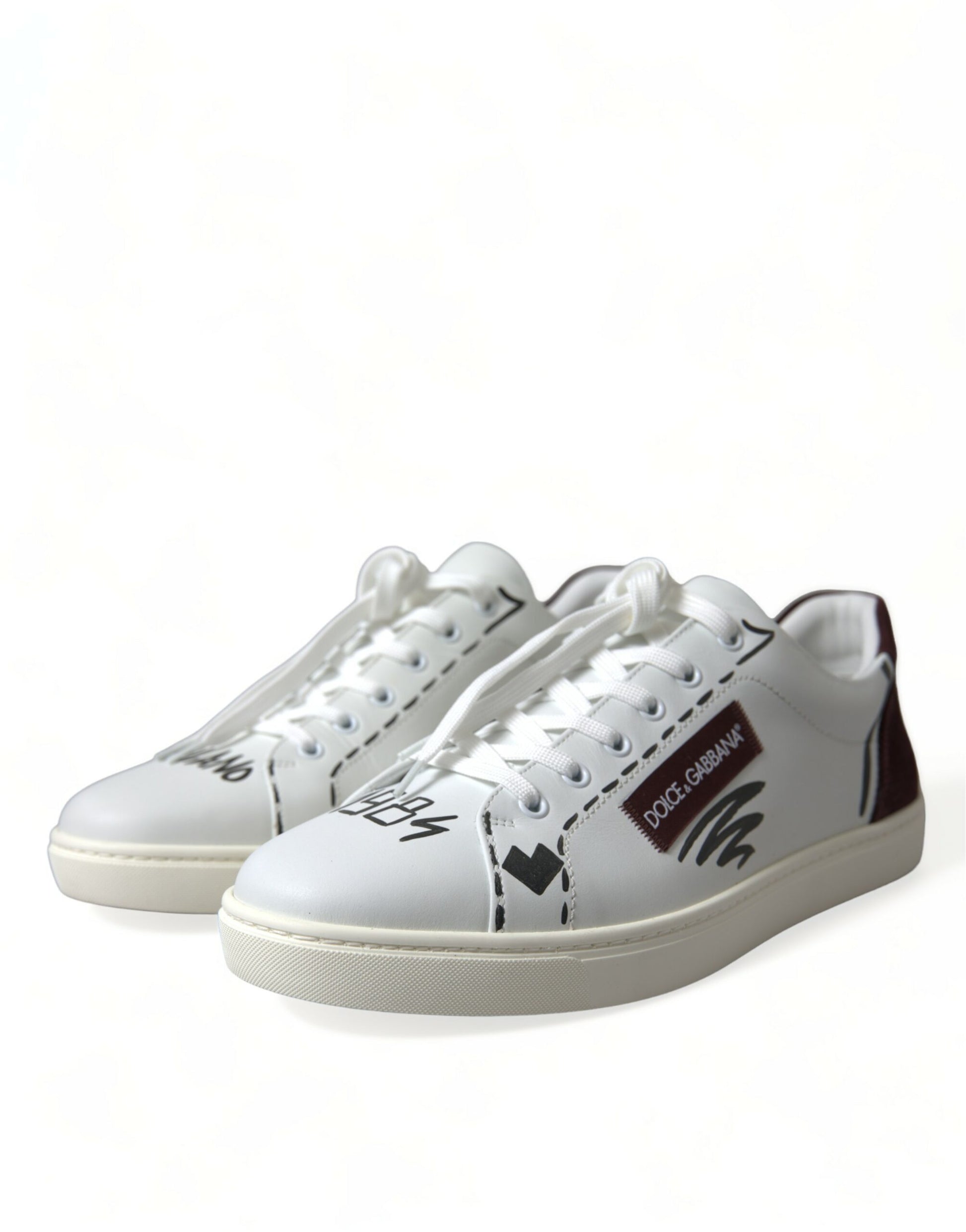Pair of white sneakers with black laces and a red logo on the side
