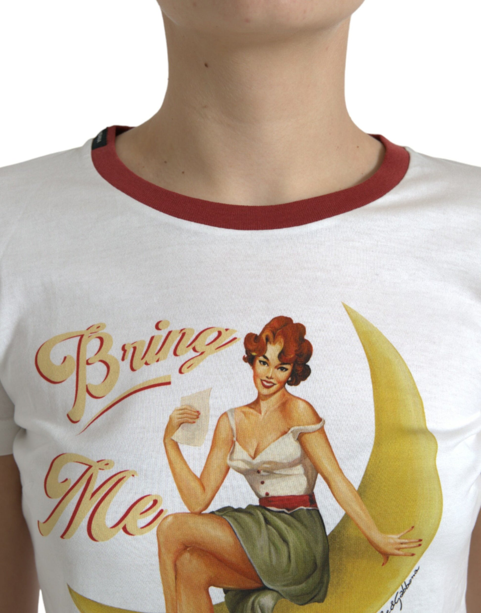 Woman wearing t-shirt with "Bring Me" written on front