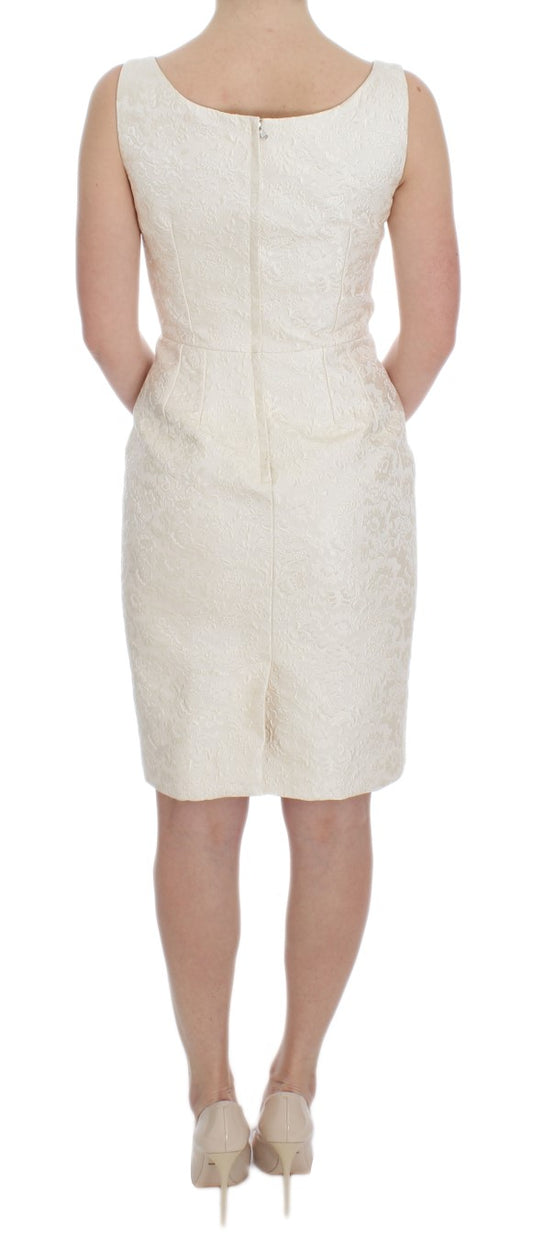 A white brocade dress with crystal embellishments, featuring a sheath silhouette and short sleeves