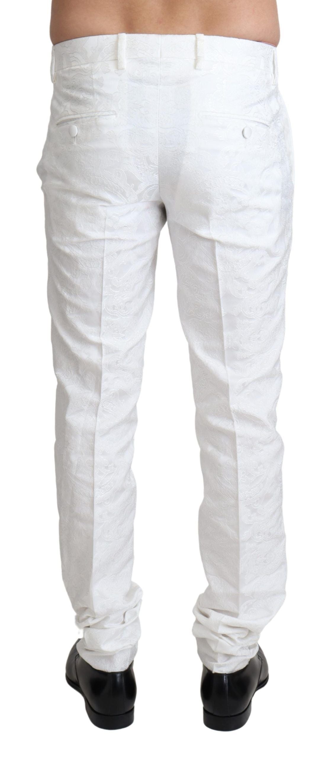A pair of white brocade trouser pants with a textured design