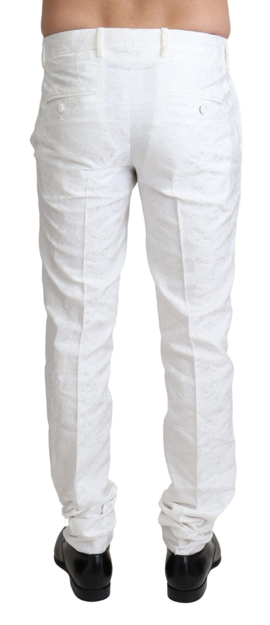 A pair of white brocade trouser pants with a textured design