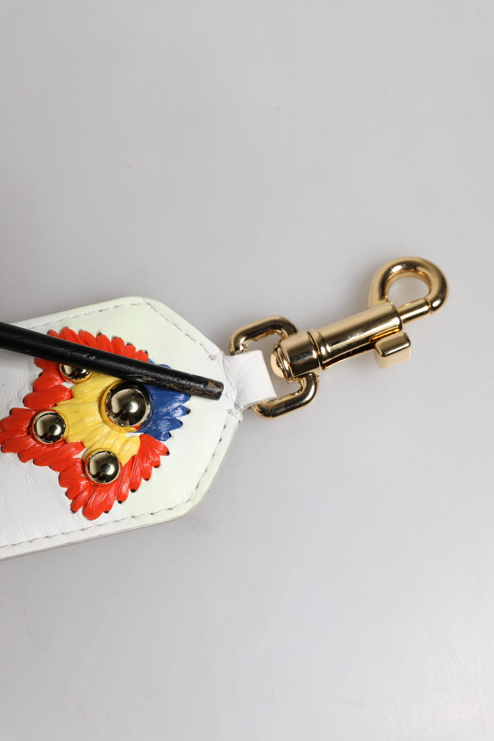 Decorative key chain with a leather case and metal hook