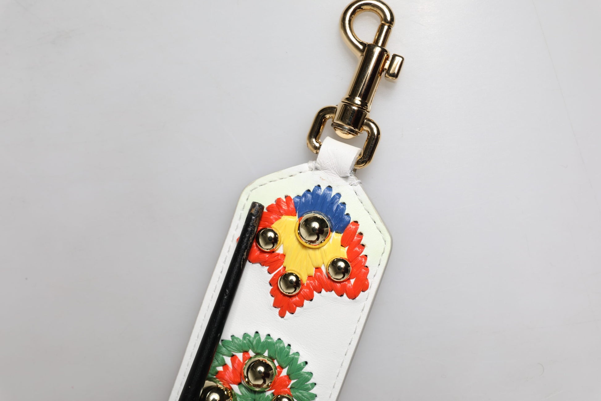 Decorative key chain with colorful beads and a leather tag
