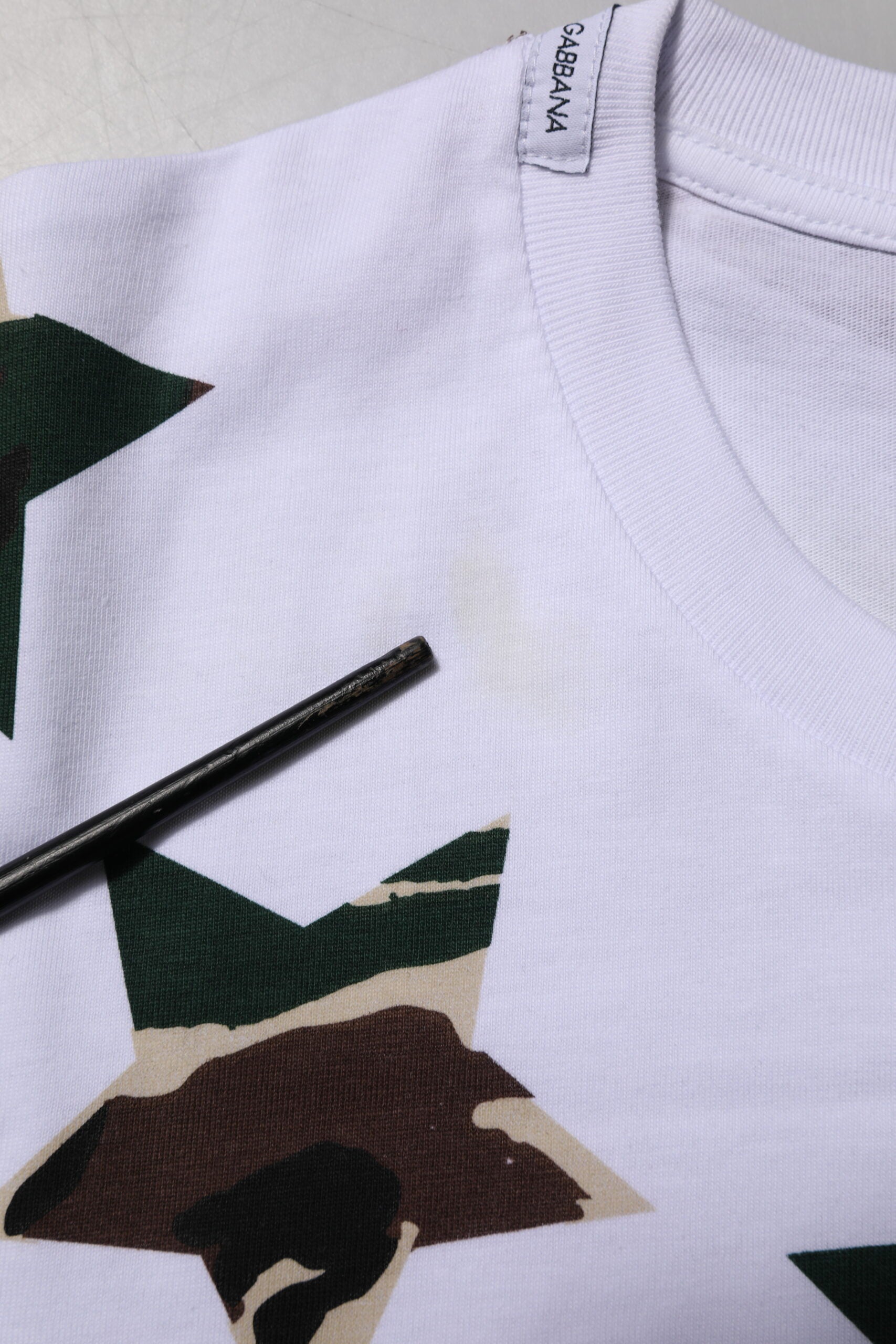 White shirt with camouflage pattern on front