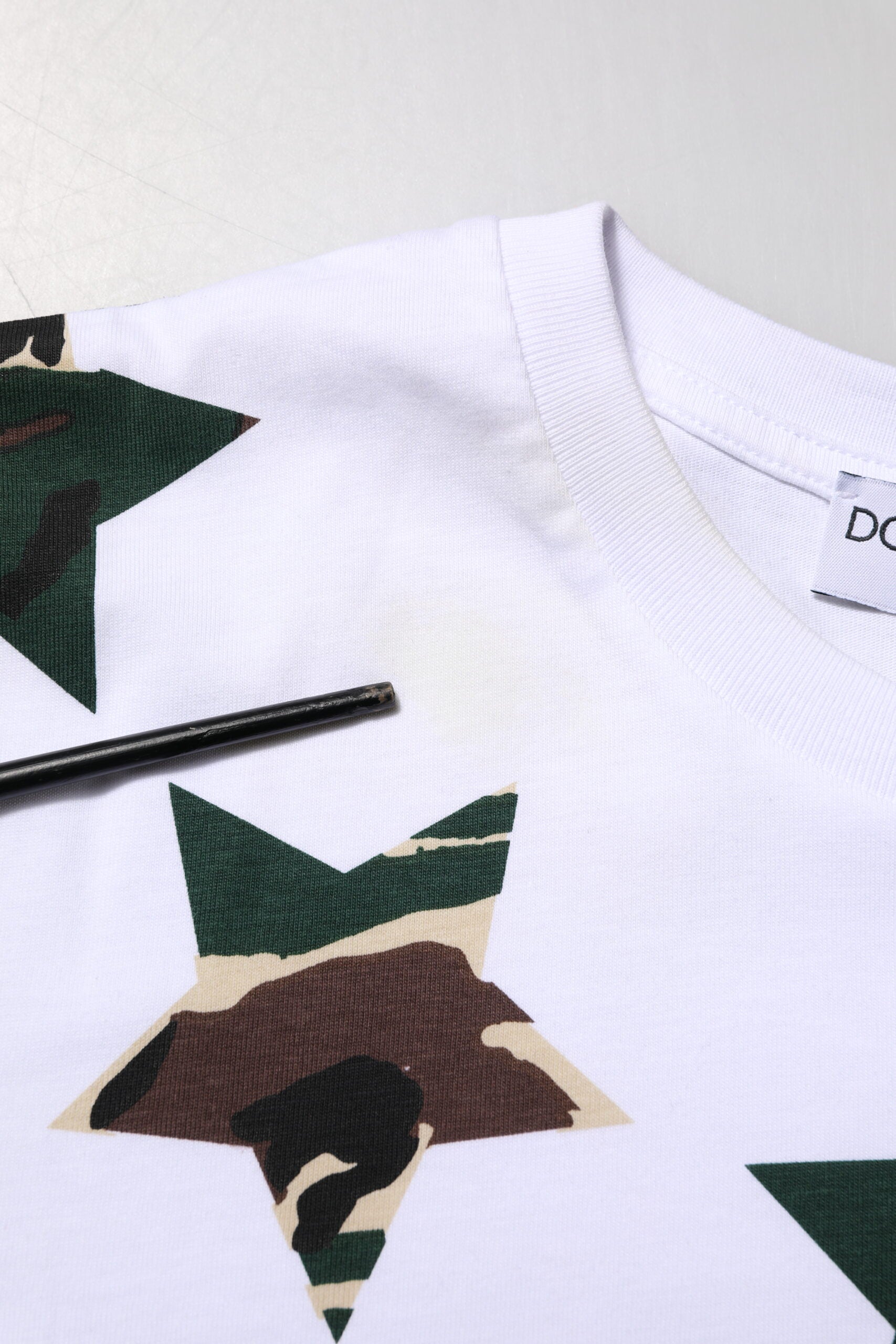 White shirt with camouflage pattern on front
