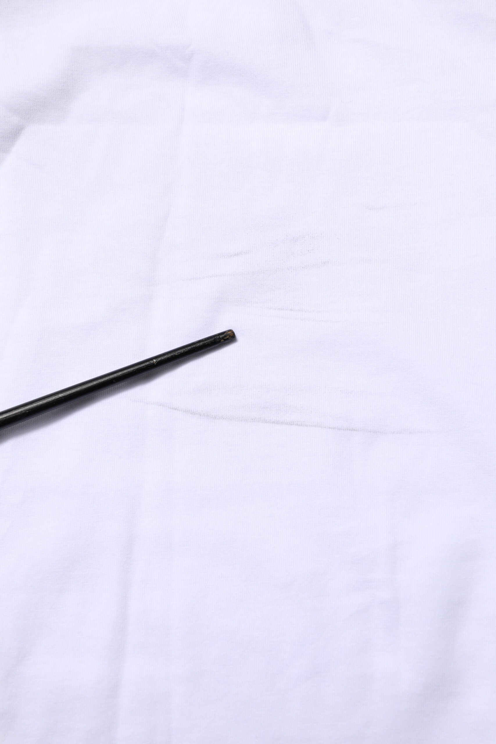Black pen on white cloth
