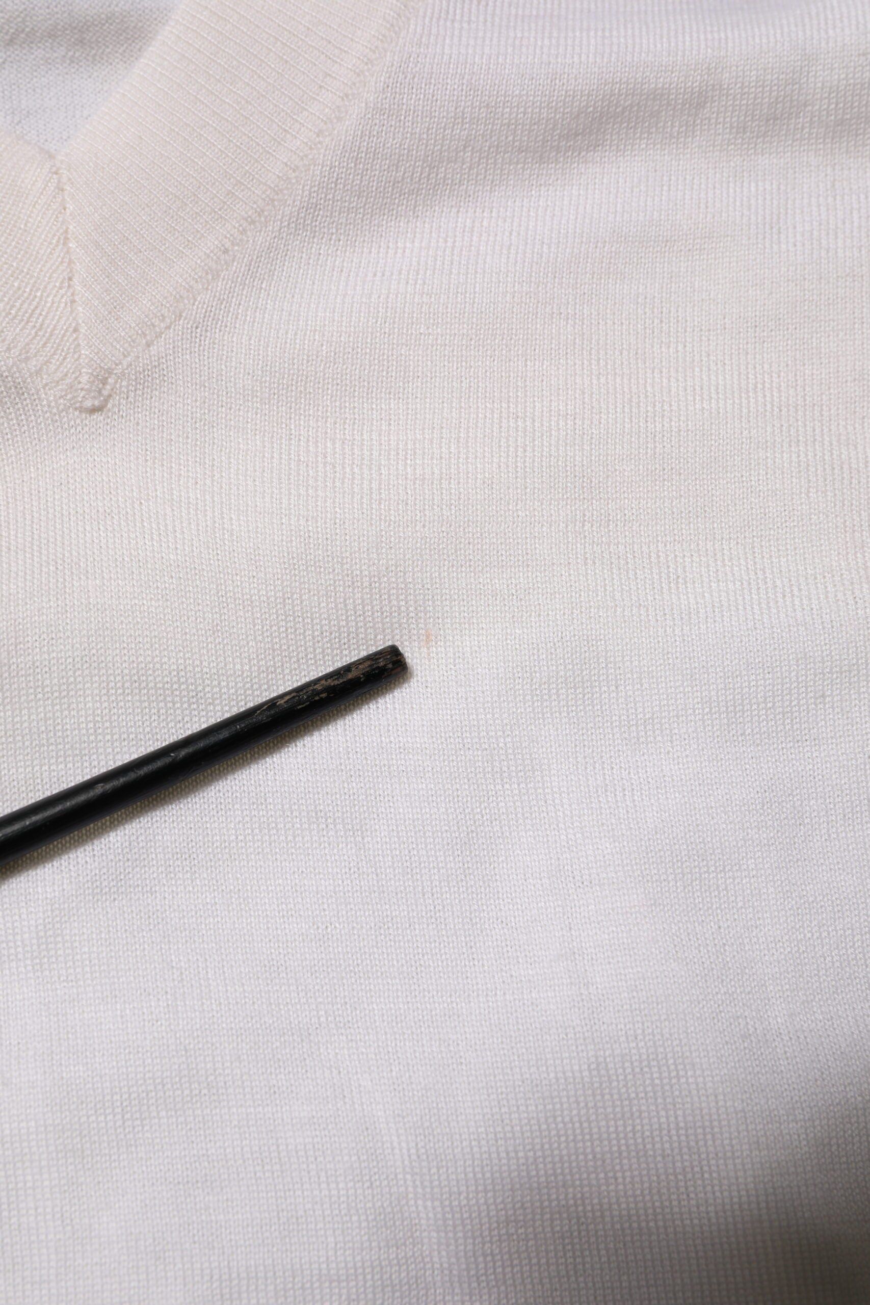 Black pen on white fabric