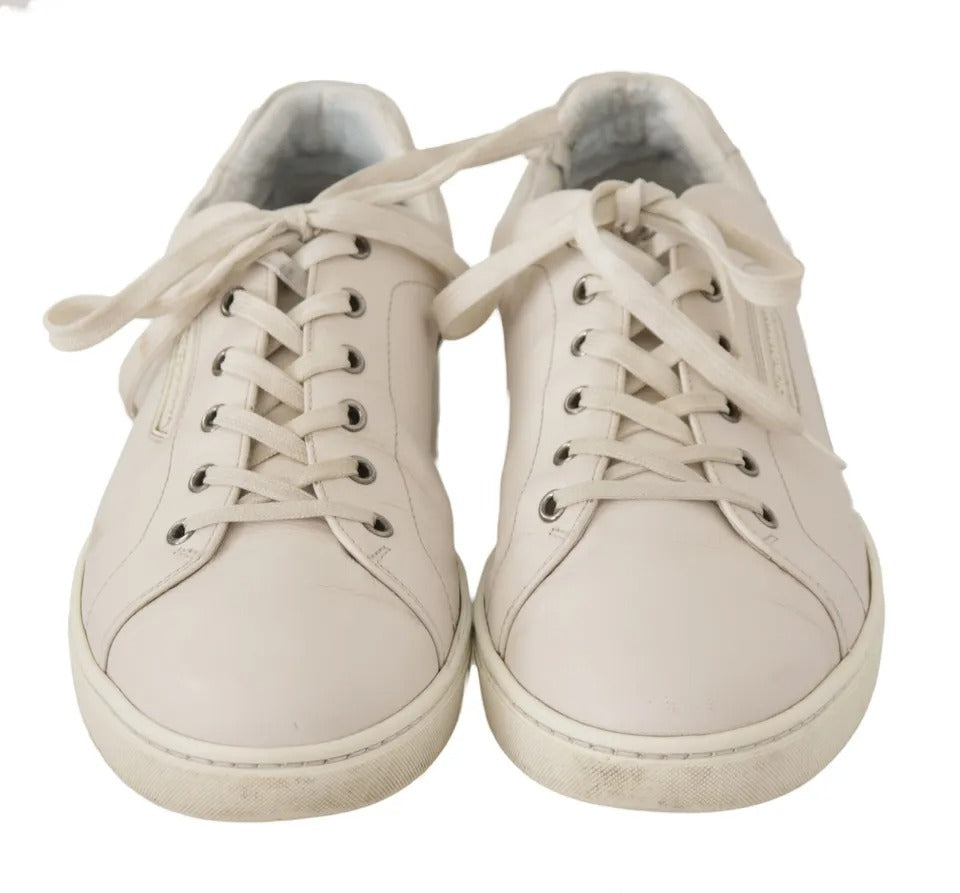 Pair of white casual leather sneakers with logo detailing, laces and rubber soles