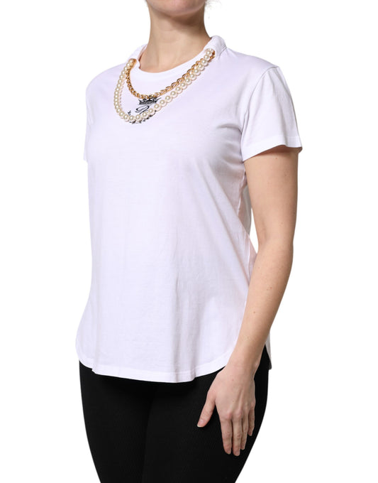 Woman wearing white shirt and necklace