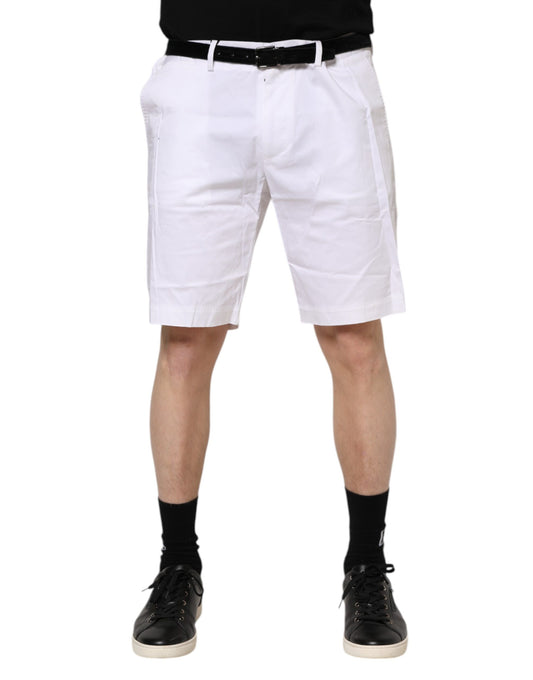 Man wearing white shorts and black shoes