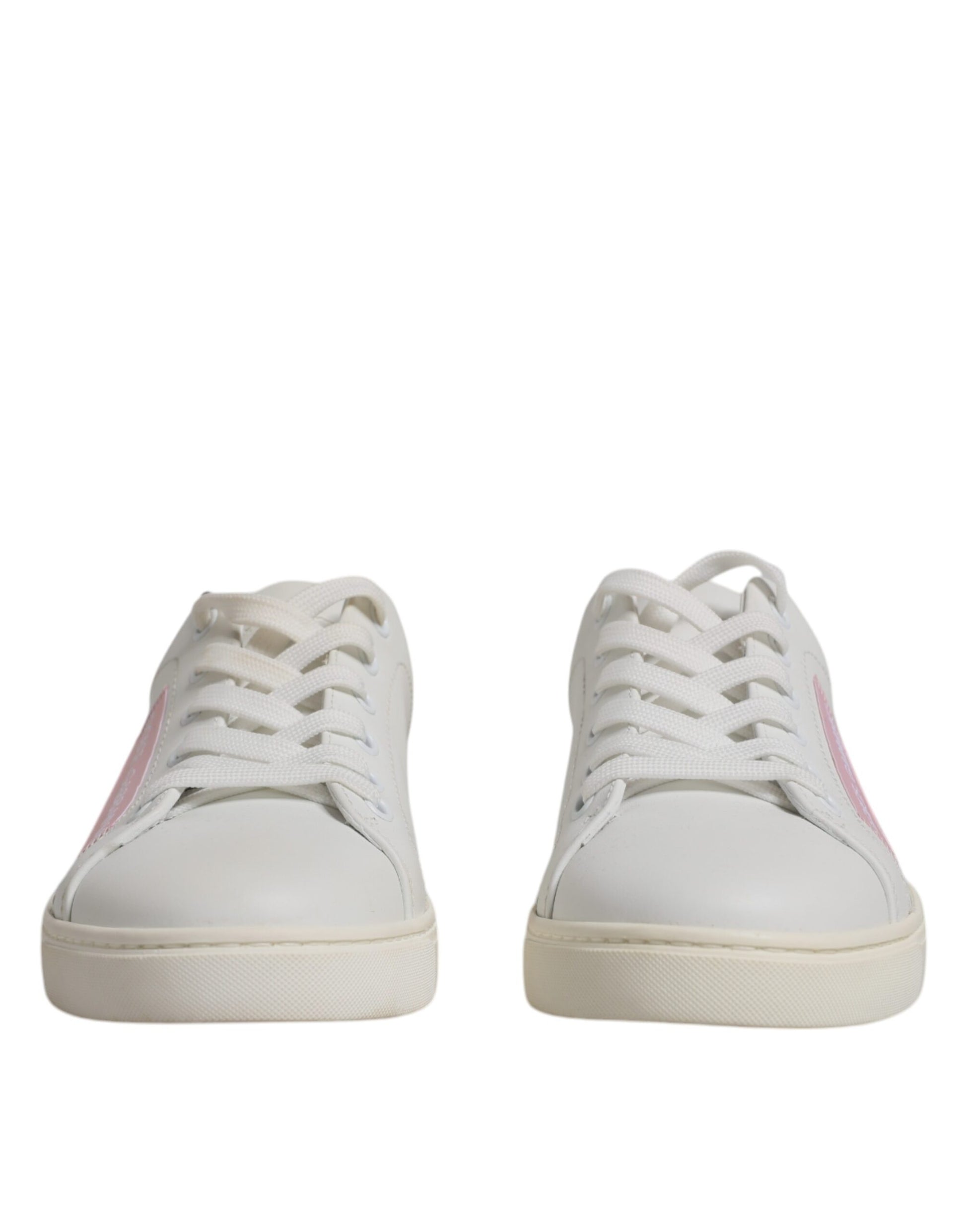 Pair of white sneakers with pink accents and laces
