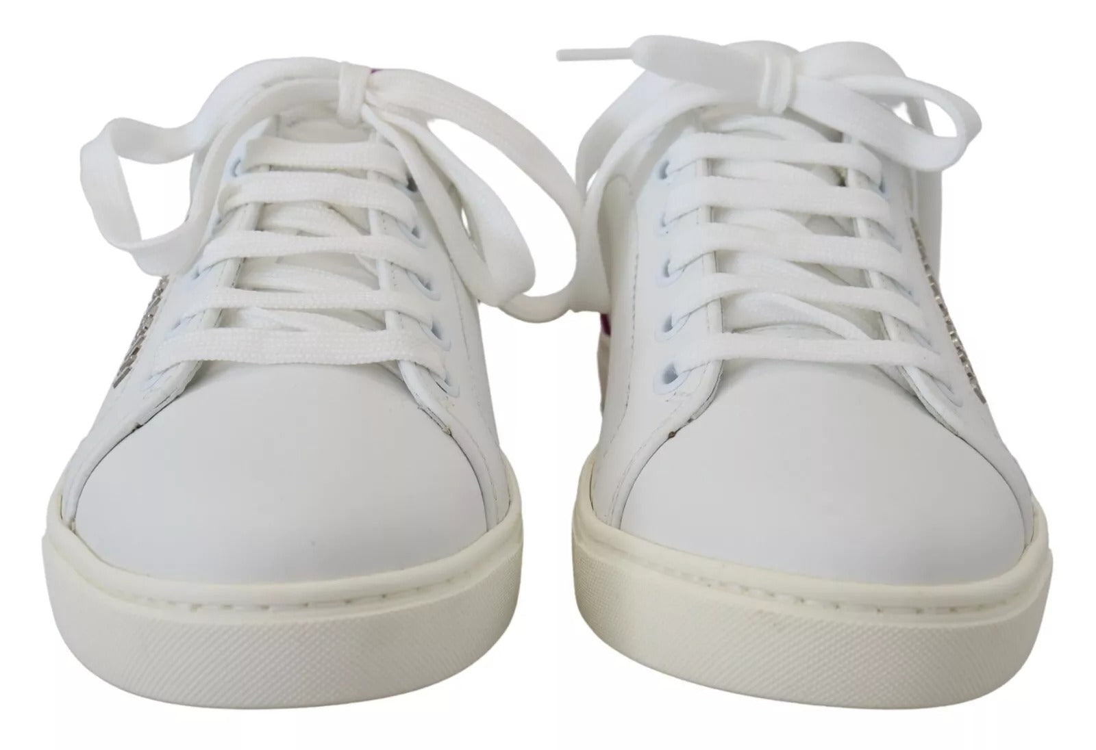 Pair of white sneakers with laces tied together