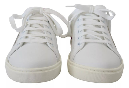 Pair of white sneakers with laces tied together