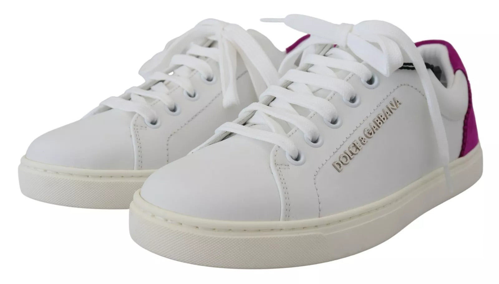 Pair of white sneakers with pink accents