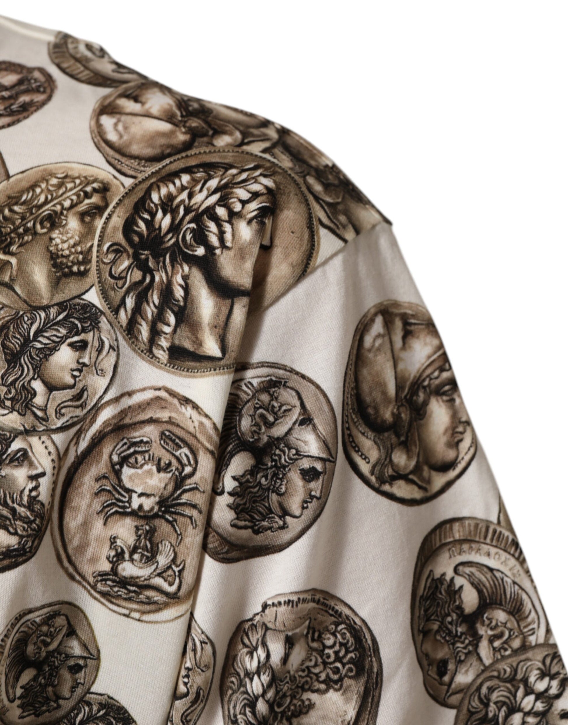 A garment with a pattern featuring ancient coins