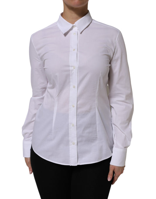 A long sleeve white collared shirt with button details and a tailored fit
