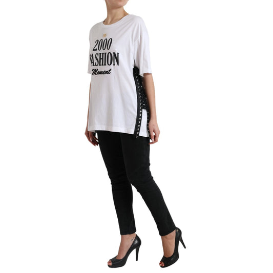 Woman wearing white t-shirt with "2009 fashion" printed on front, black pants, and high heels