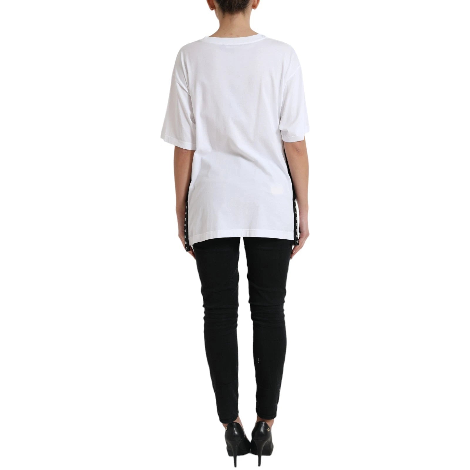 Woman wearing white shirt and black pants