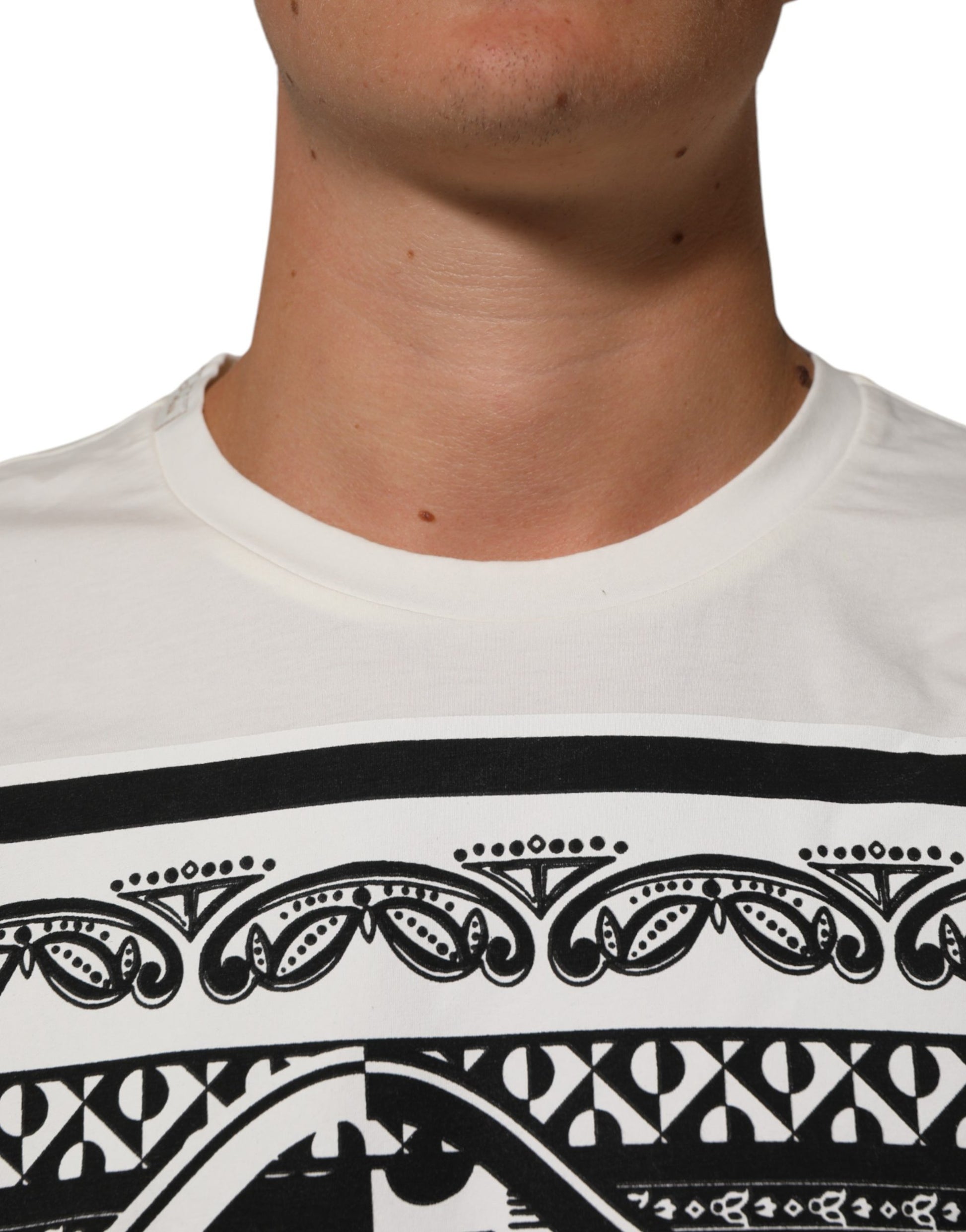 Man wearing white t-shirt with black design on front