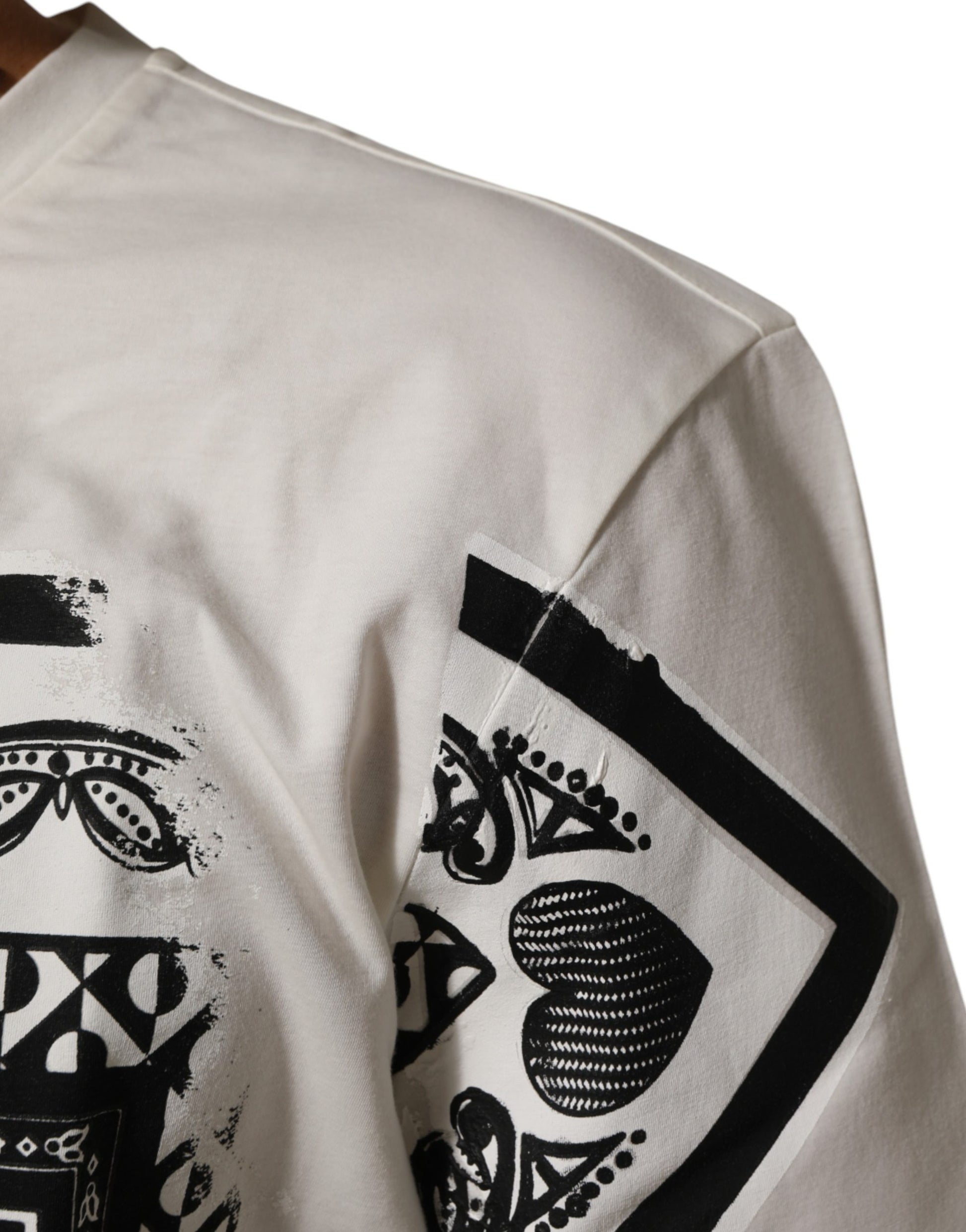 White long sleeve shirt with black design on shoulder