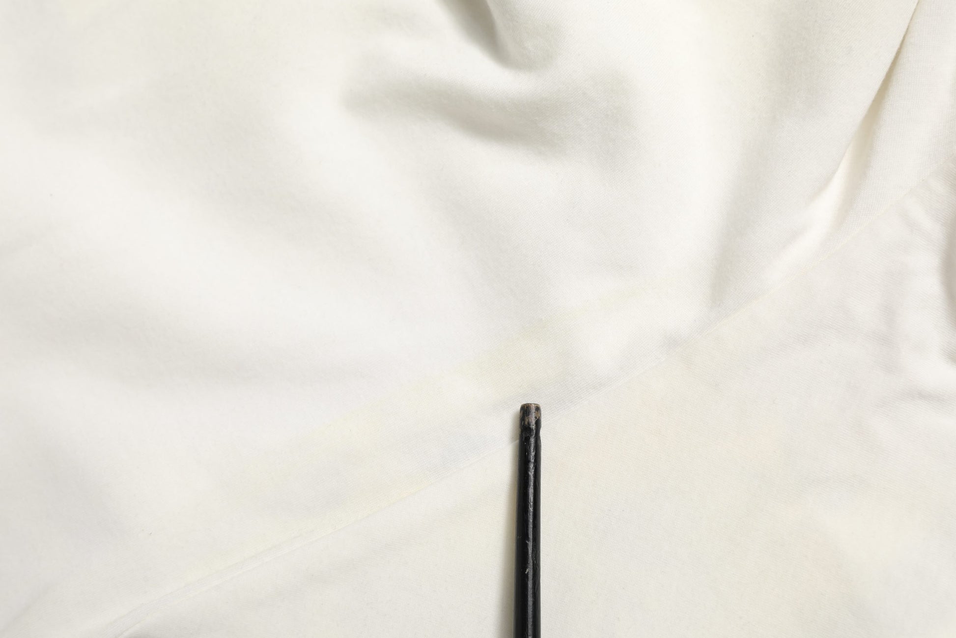 White fabric with black zipper