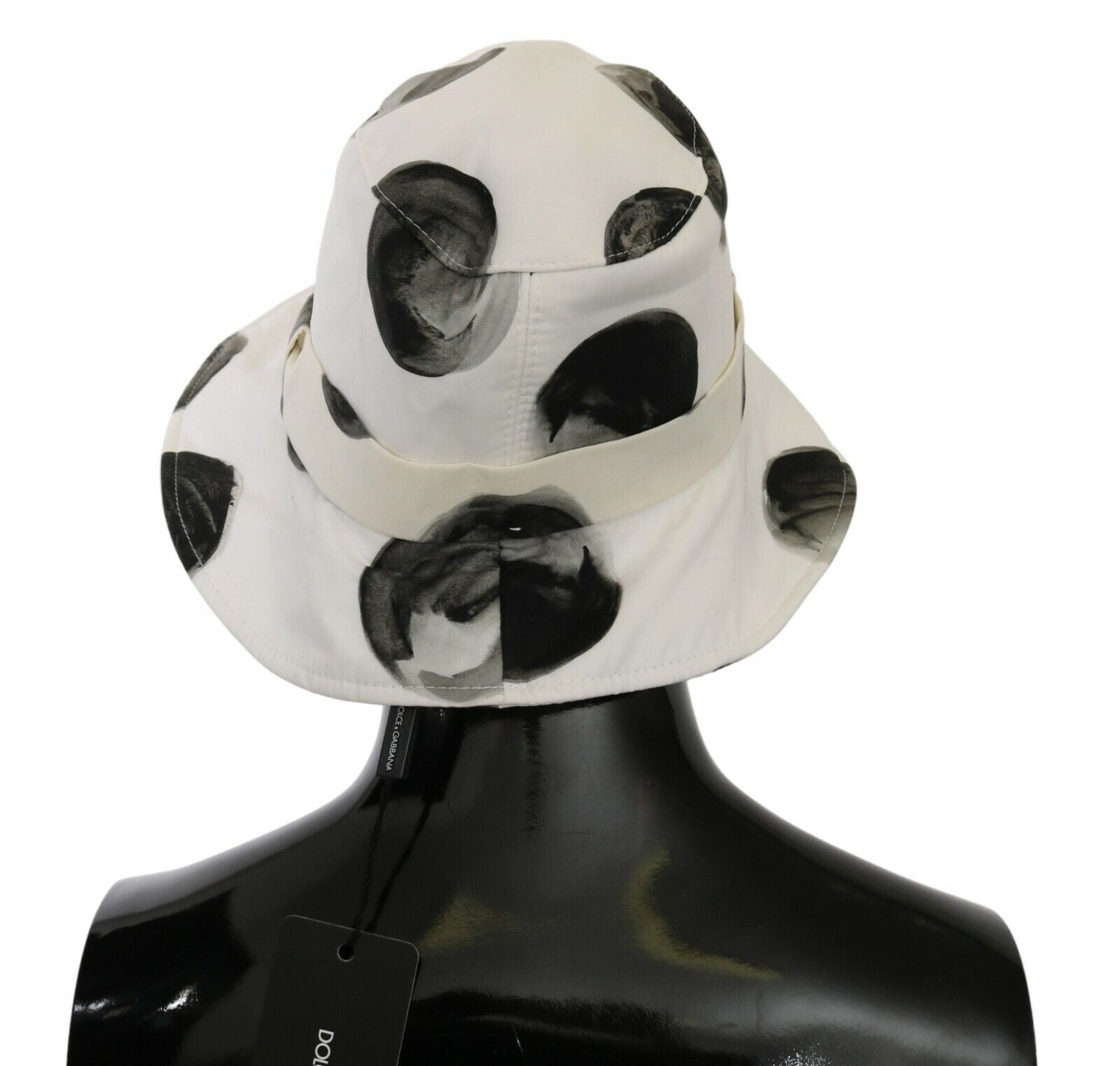 White hat with black spots on a mannequin
