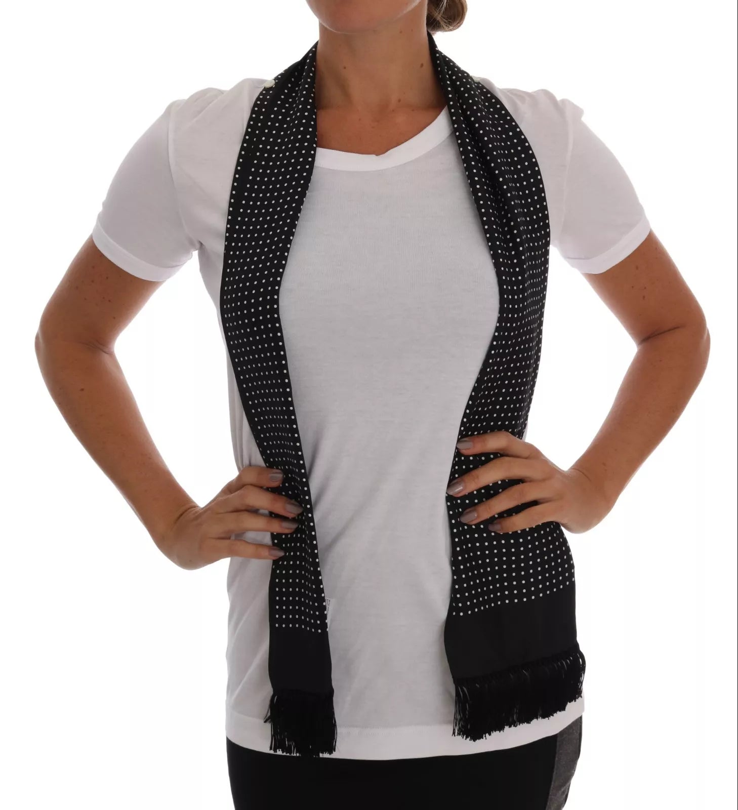 Black and white scarf worn by woman in white shirt