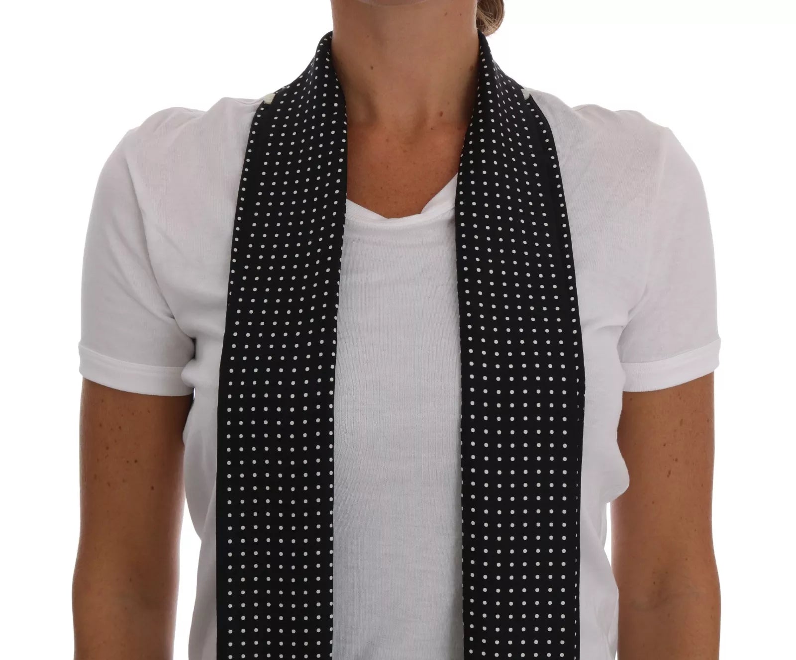 Black and white polka dot scarf worn by woman