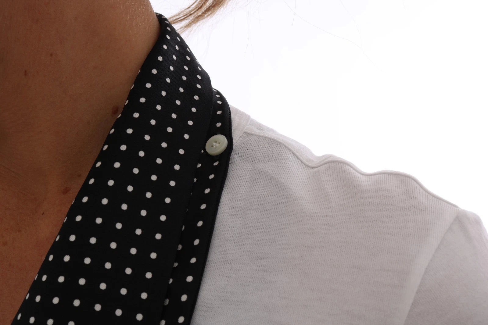 White blouse with black polka dots on collar