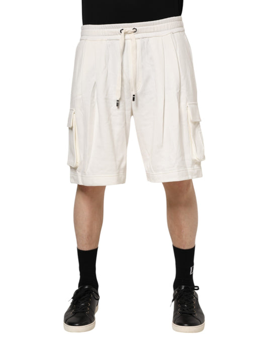 Man wearing white shorts and black shoes