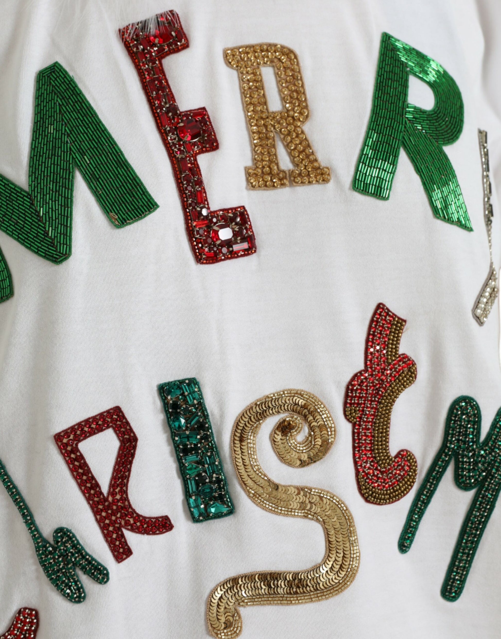 Christmas shirt with sequins spelling out "Merry Christmas"