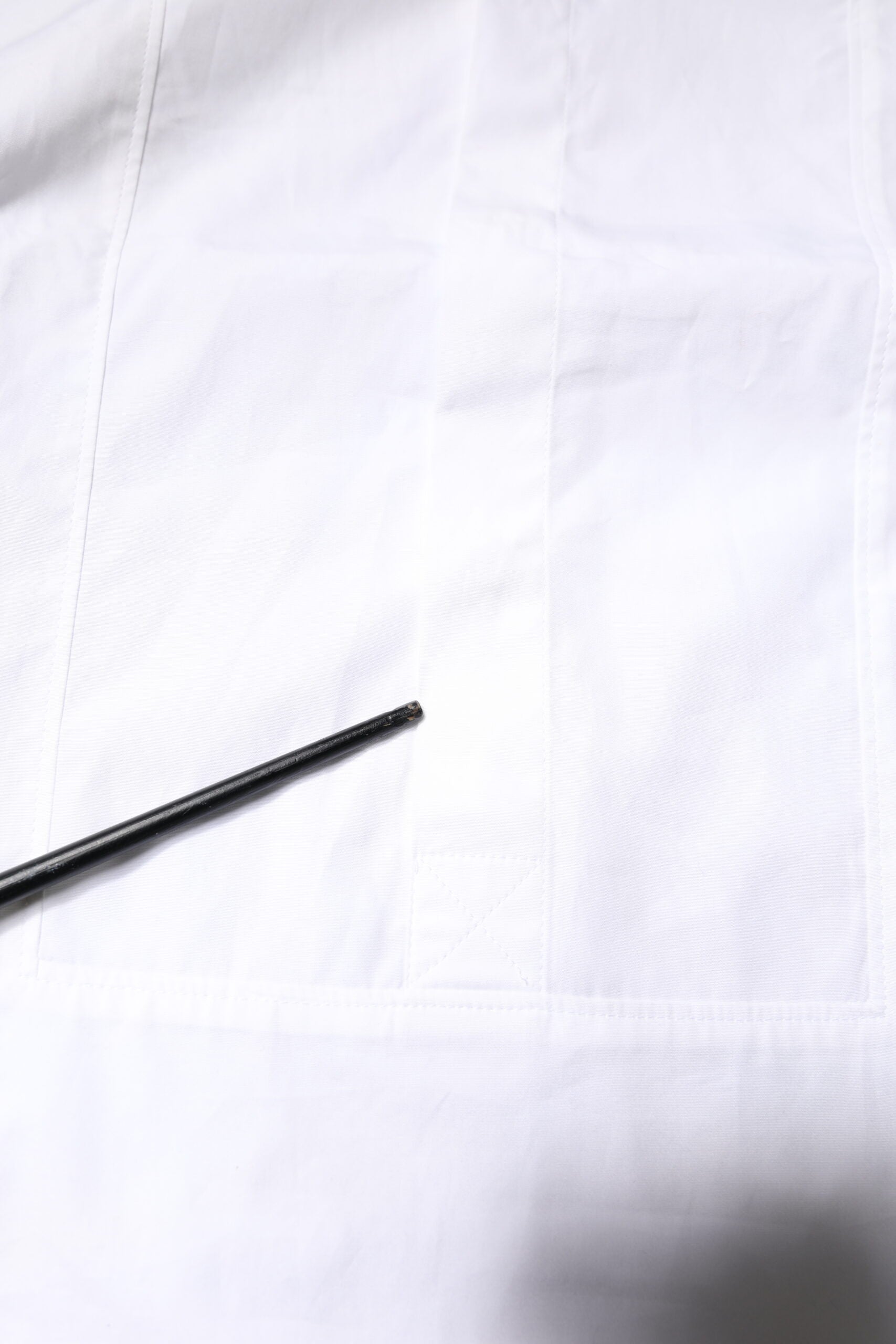 A black tie on a white shirt