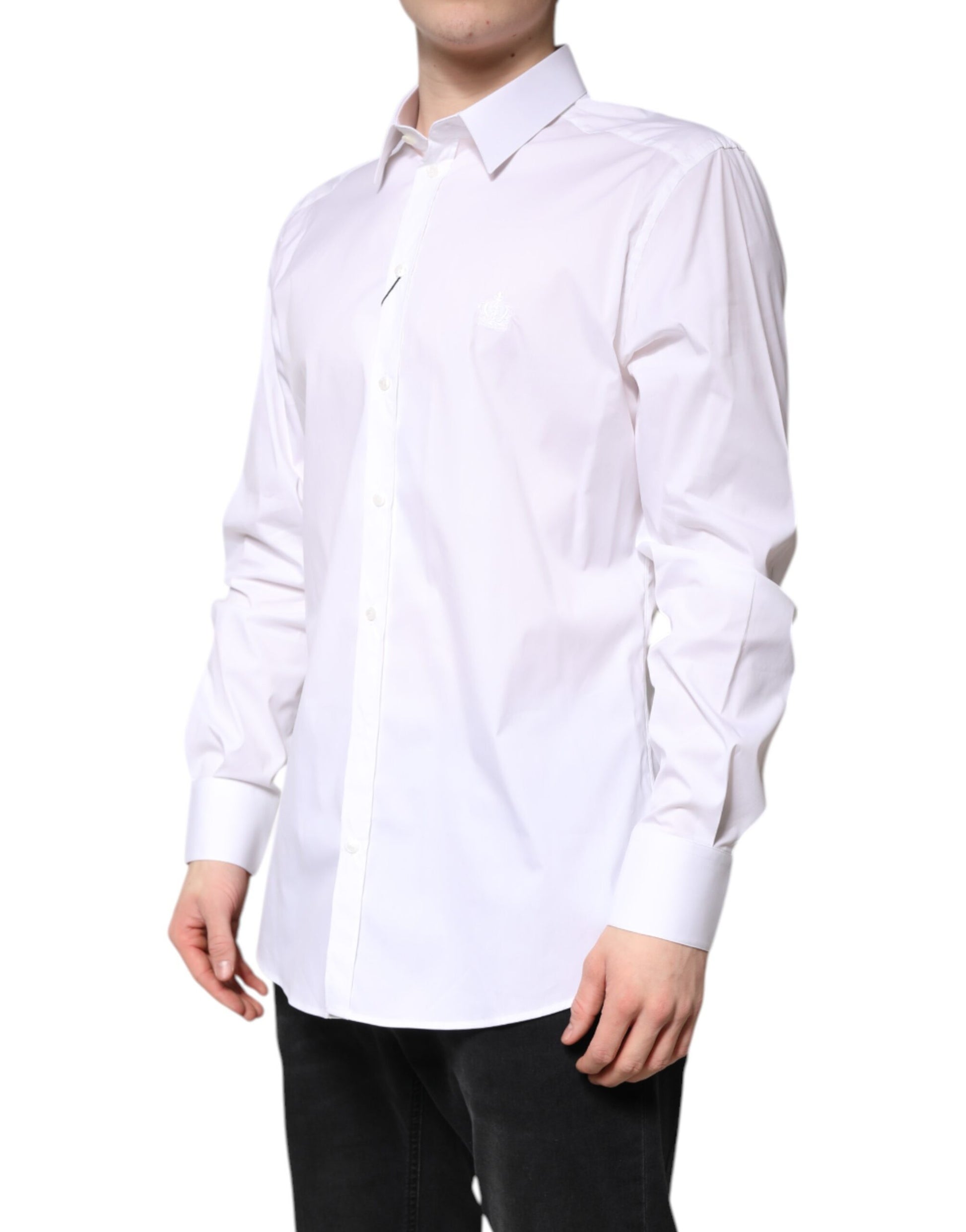 A white cotton collared shirt with a gold emblem on the left chest