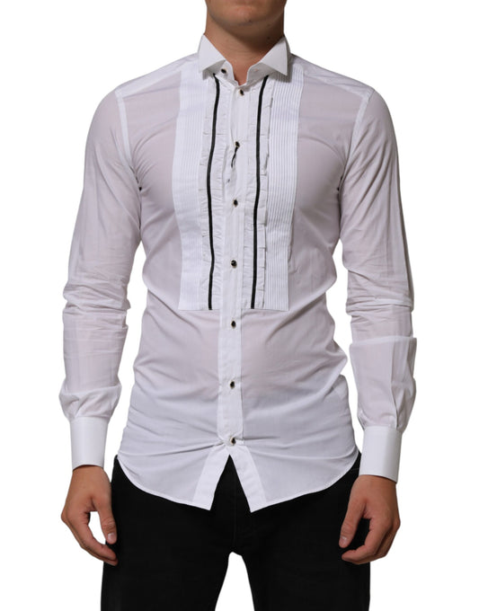 A mannequin wearing a white cotton collared long sleeve shirt with gold accents