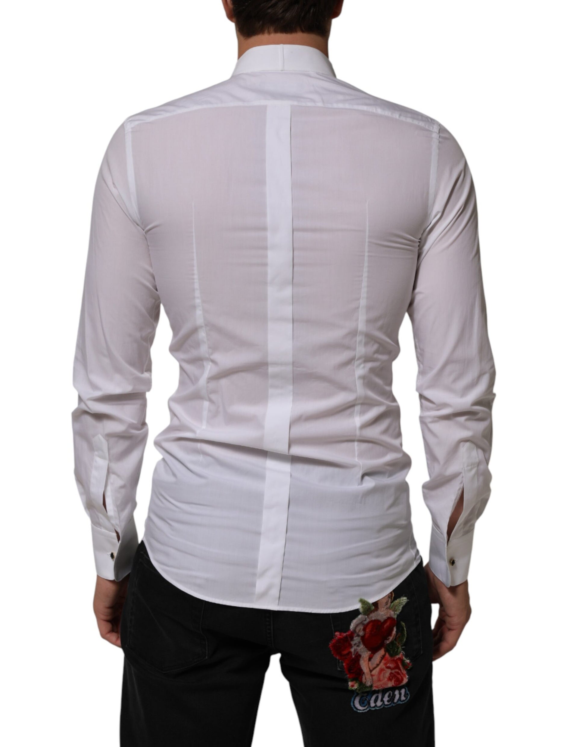 A white cotton collared long sleeve shirt with gold detailing