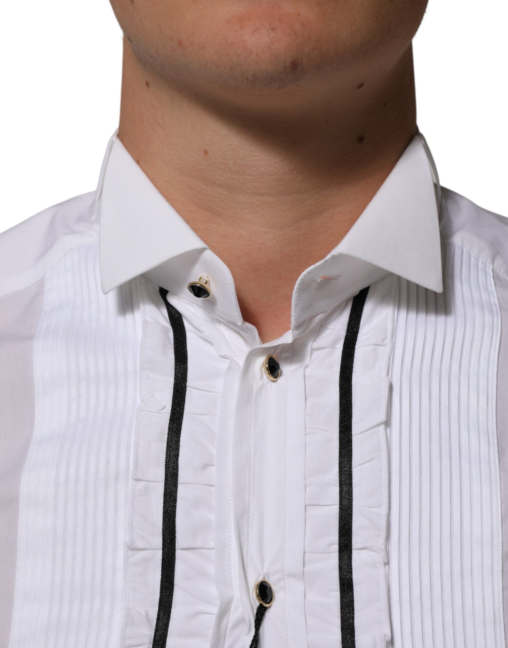 A white cotton collared long sleeve shirt with gold accents