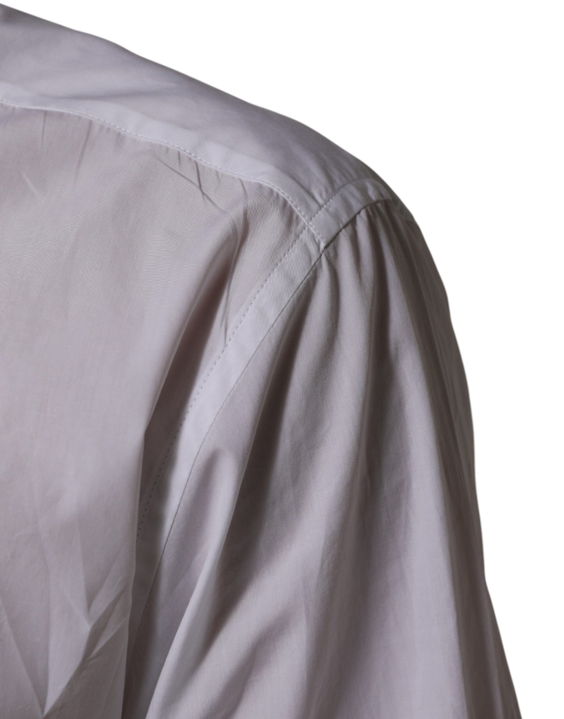 A close-up of a white cotton collared men's dress shirt