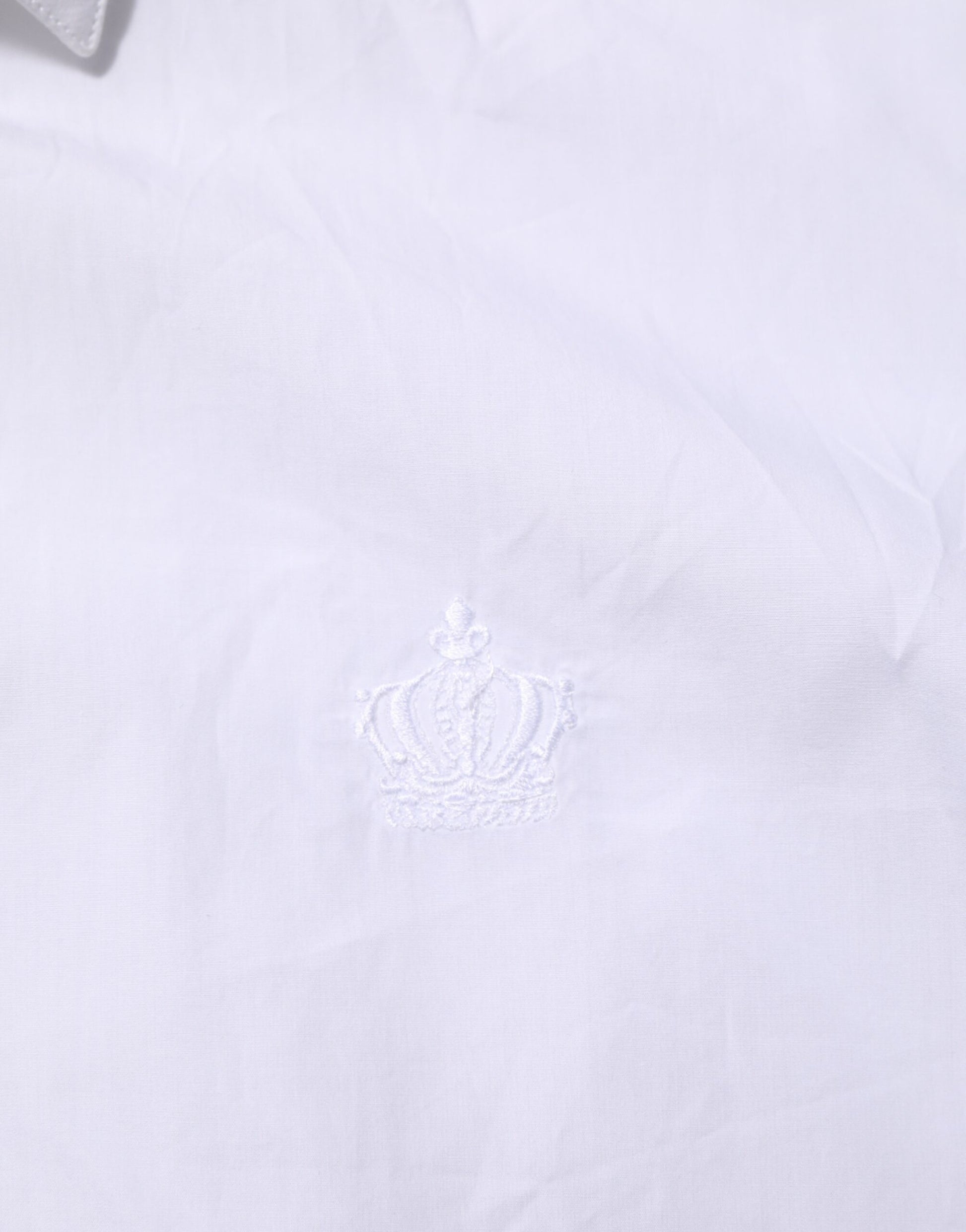 A white cotton collared dress shirt with a crown embroidered on the left chest