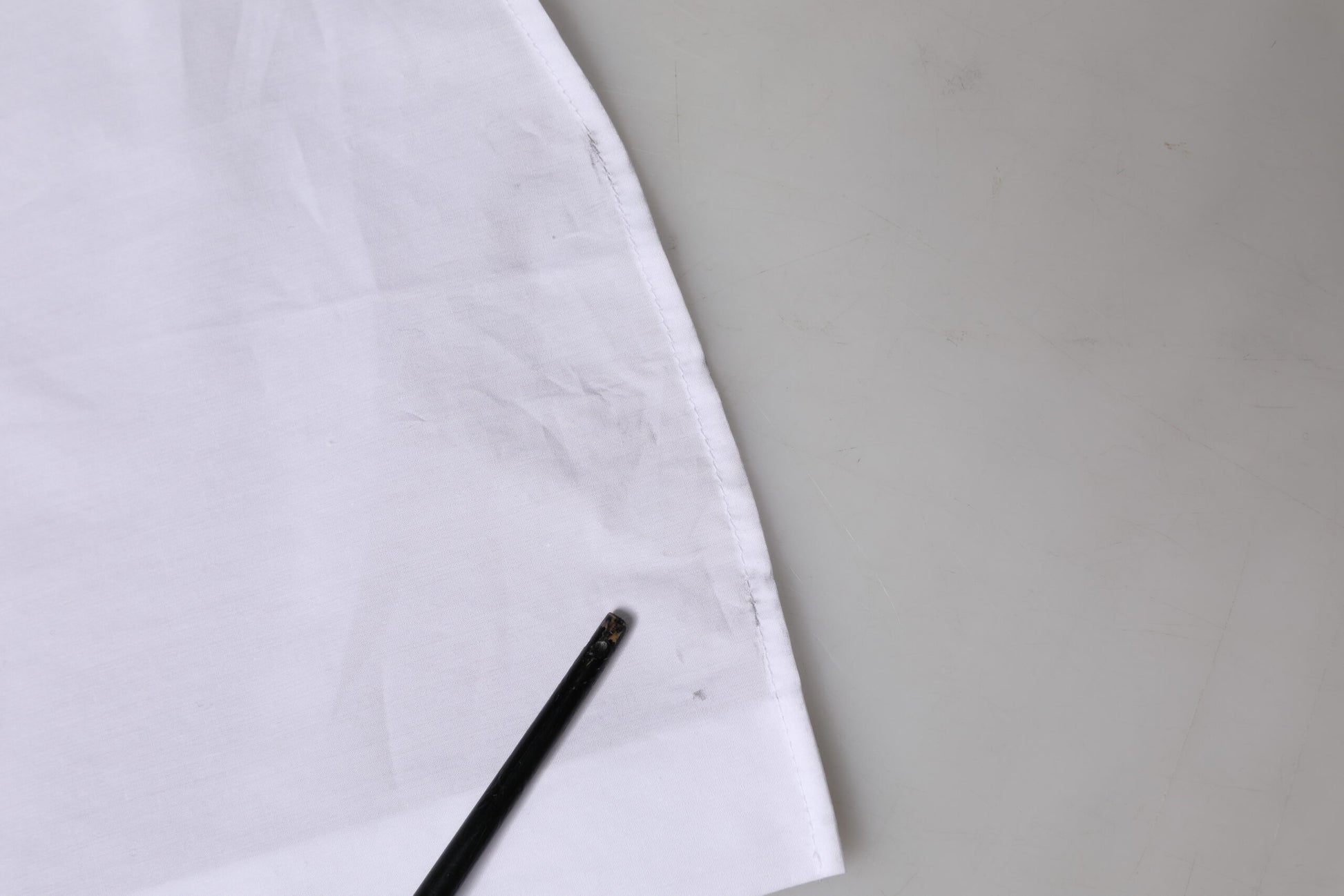 White cloth napkin with black stains on it