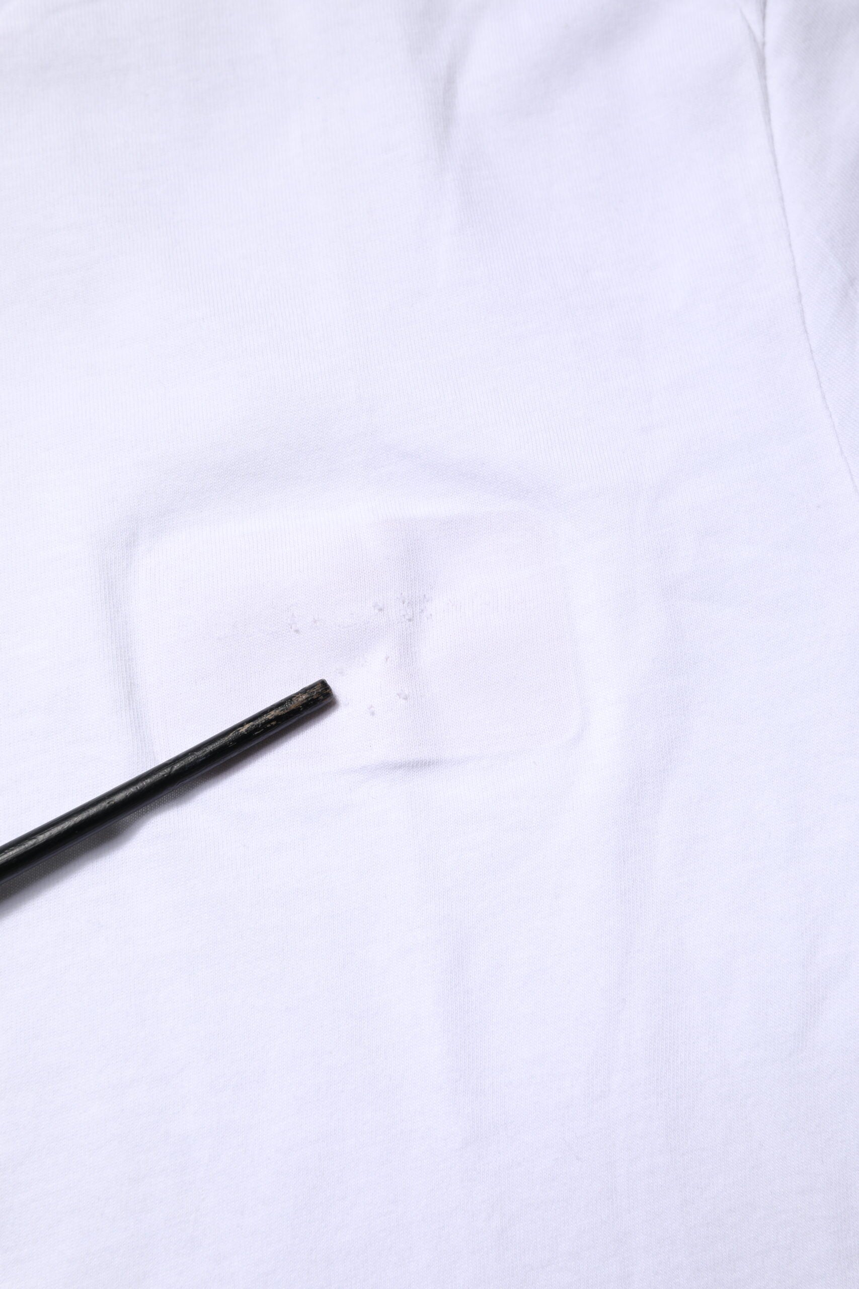 White t-shirt with a hole in the front