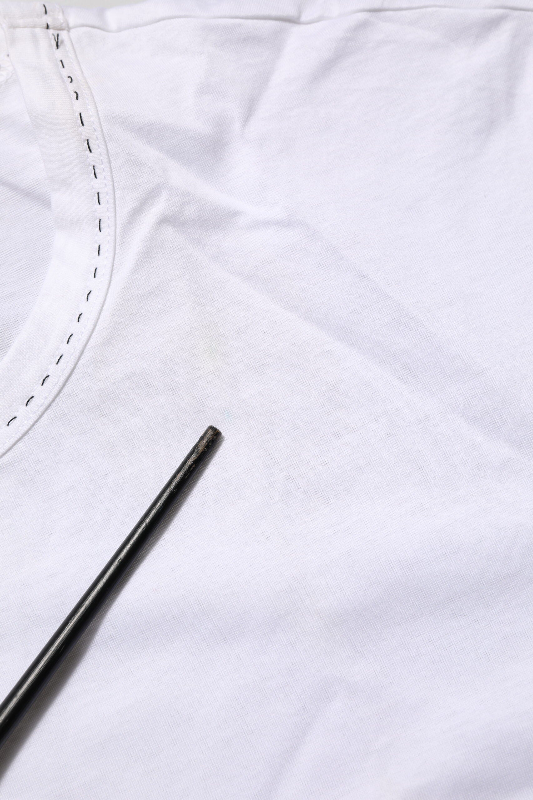 Black chopsticks on white fabric
